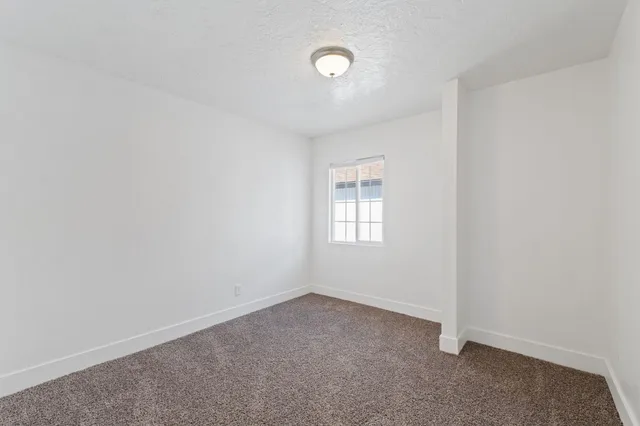 an empty room with a empty space and a window