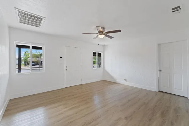 a view of an empty room with a window