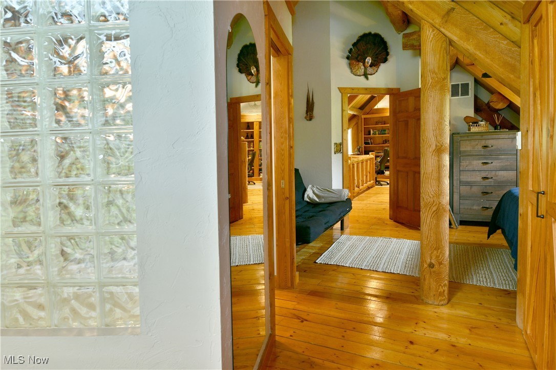 18102 Owen Road Middlefield, OH 44062 - Photo 33 of 50 Hallway with light wood finished floors and arched walkways
