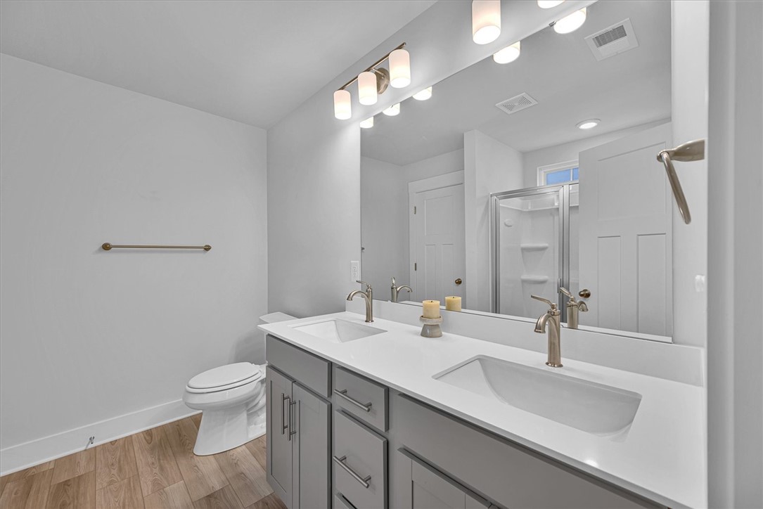 529 Overbrook Drive Seneca, SC 29678 - Photo 17 of 33 This spacious bathroom offers a contemporary vanity with double sinks, sleek fixtures, and a shower.