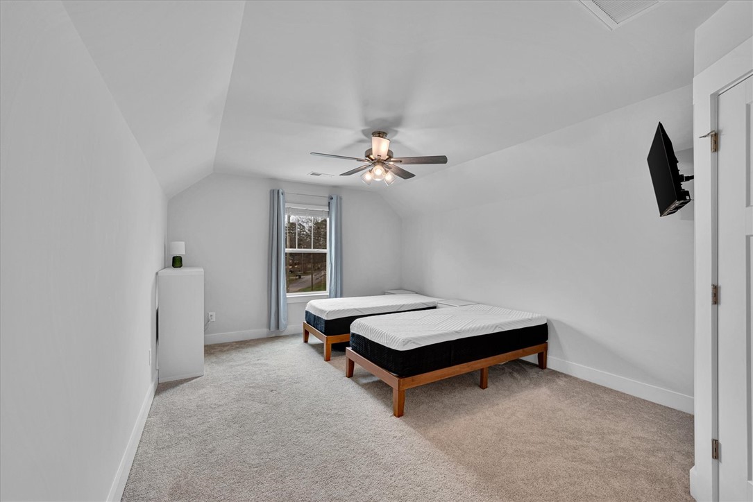 529 Overbrook Drive Seneca, SC 29678 - Photo 19 of 33 This spacious bedroom offers ample natural light and a serene atmosphere for relaxation.