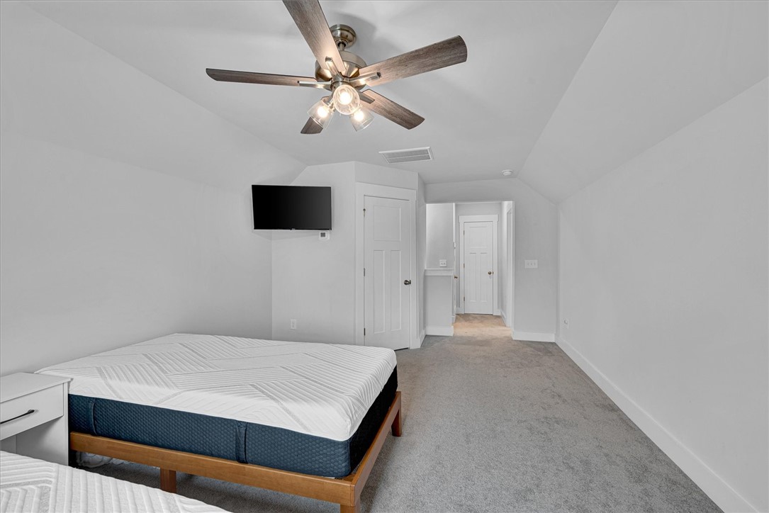 529 Overbrook Drive Seneca, SC 29678 - Photo 20 of 33 This spacious room features a ceiling fan, carpeting, and bright white walls.