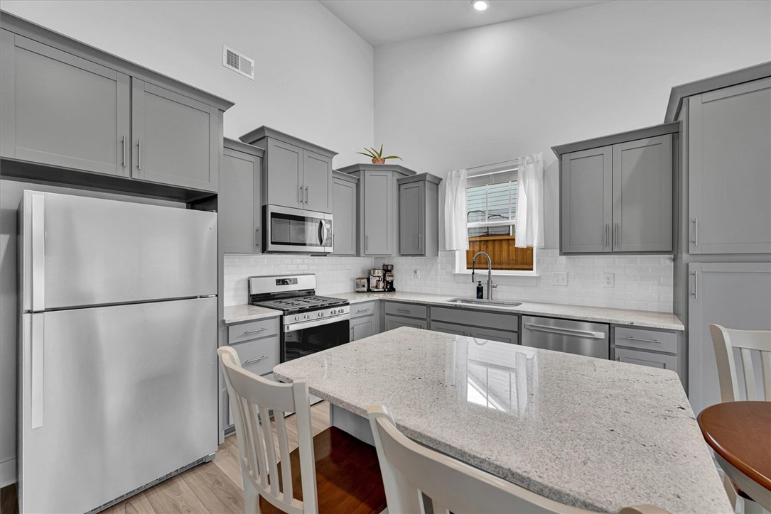 529 Overbrook Drive Seneca, SC 29678 - Photo 8 of 33 This kitchen showcases a clean aesthetic with modern appliances and a spacious island.