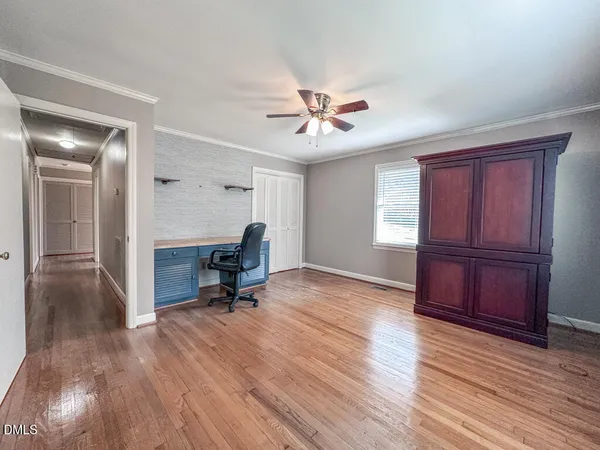 a view of a livingroom with a furniture and wooden floor