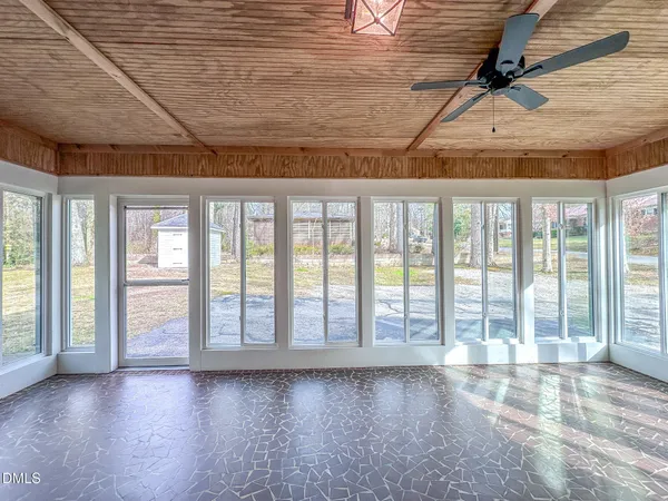 a view of an empty room with a window