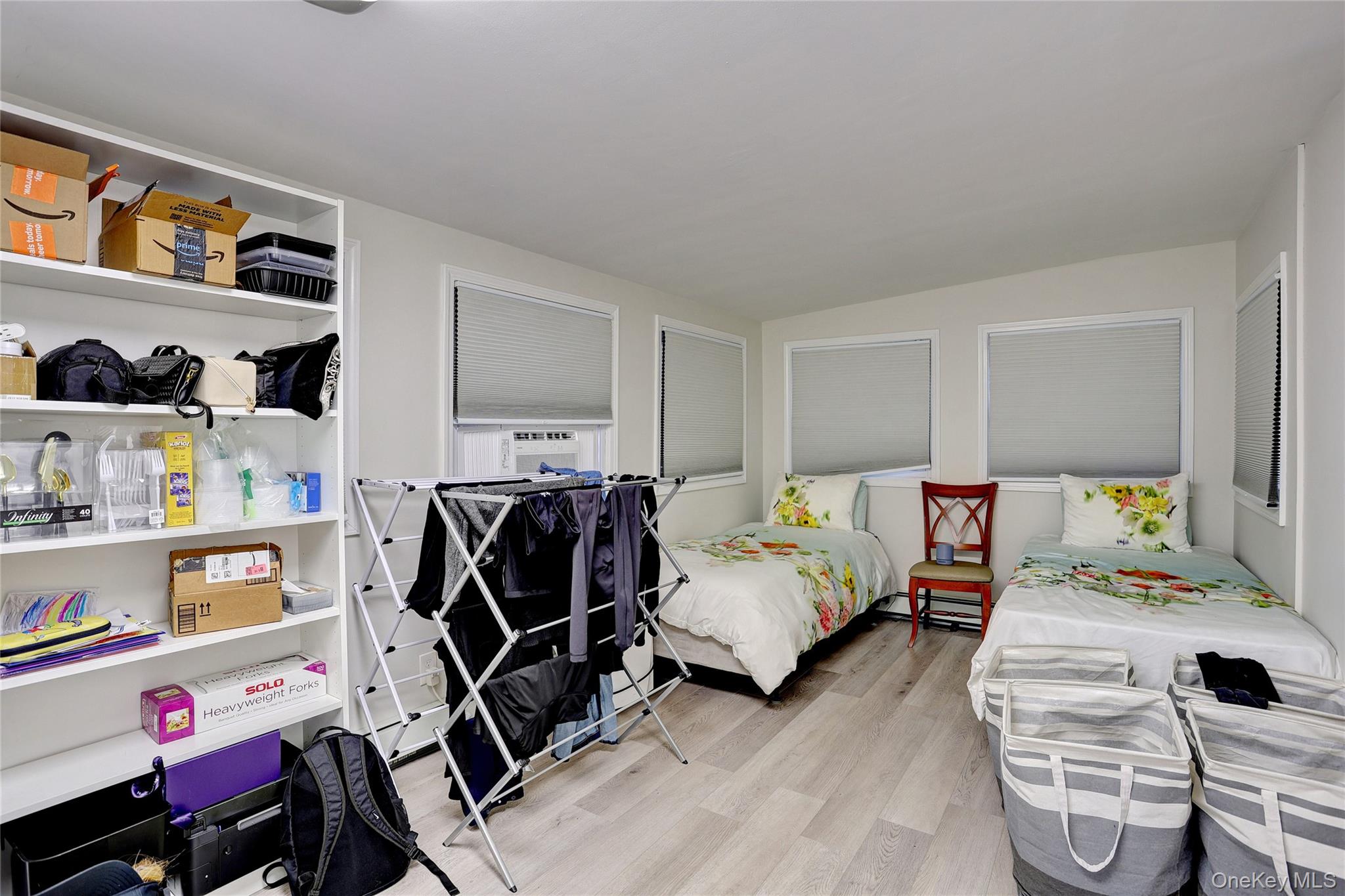 35 Regina Road Monsey, NY 10952 - Photo 12 of 34 Bedroom featuring light wood-style flooring, cooling unit, and lofted ceiling