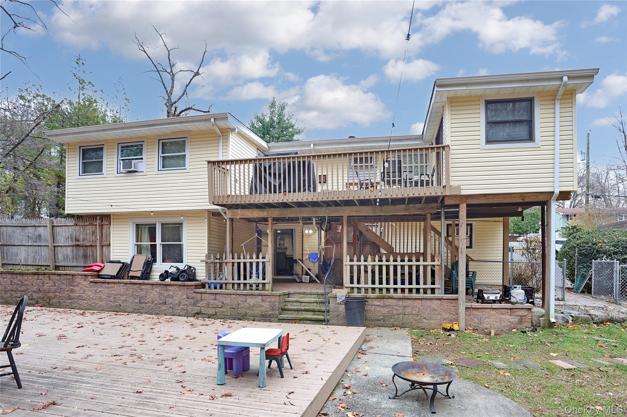 35 Regina Road Monsey, NY 10952 - Photo 21 of 34 Back of property with a patio, a deck, an outdoor fire pit, and stairs