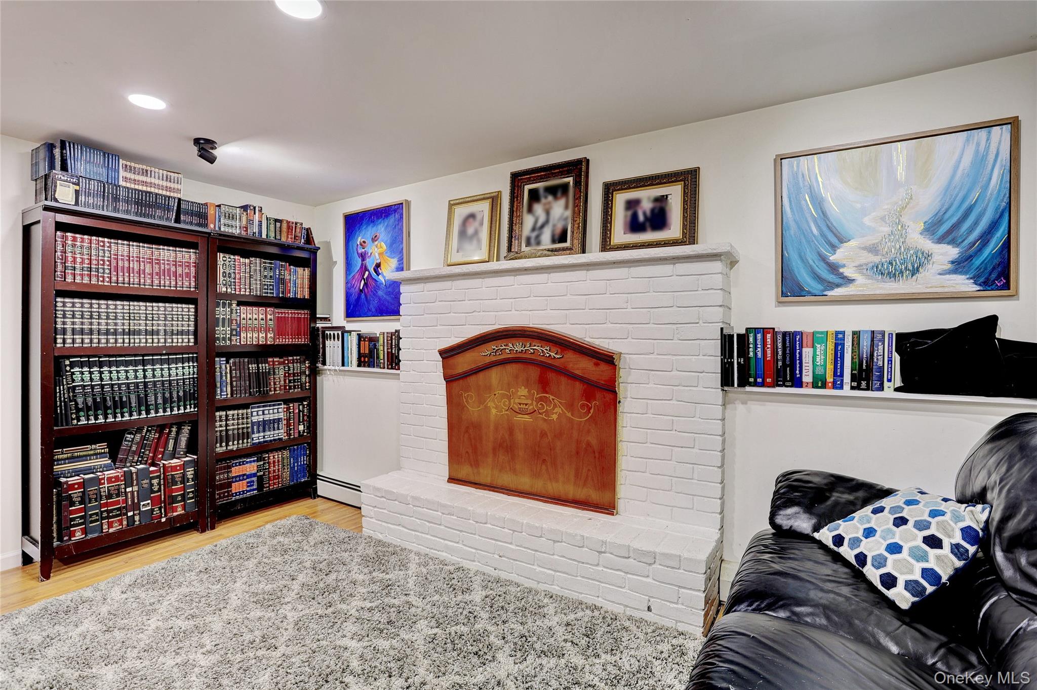 35 Regina Road Monsey, NY 10952 - Photo 25 of 34 Sitting room with light wood-style floors, a fireplace, a baseboard heating unit, and recessed lighting