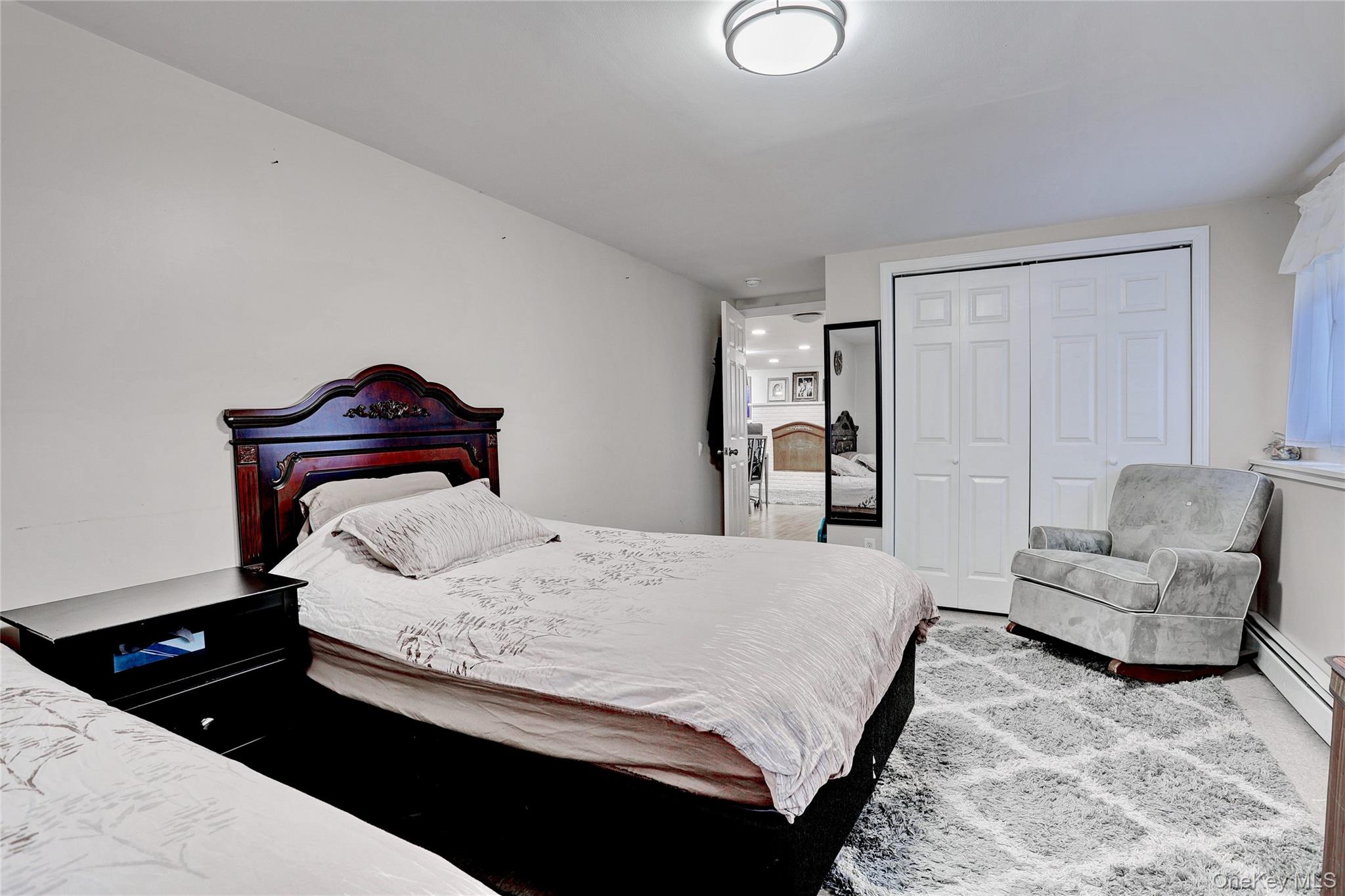 35 Regina Road Monsey, NY 10952 - Photo 28 of 34 Bedroom featuring a baseboard radiator and a closet