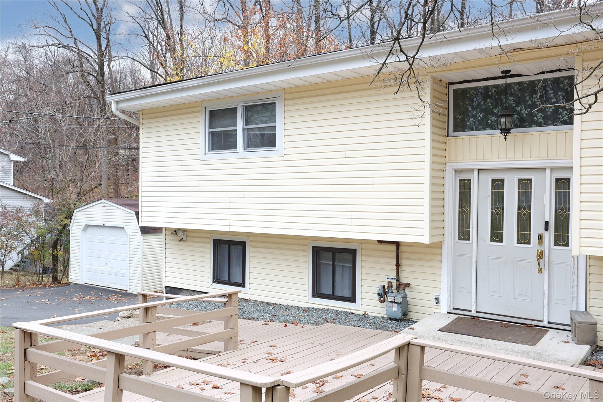 35 Regina Road Monsey, NY 10952 - Photo 4 of 34 View of front of house with a wooden deck and an outdoor structure