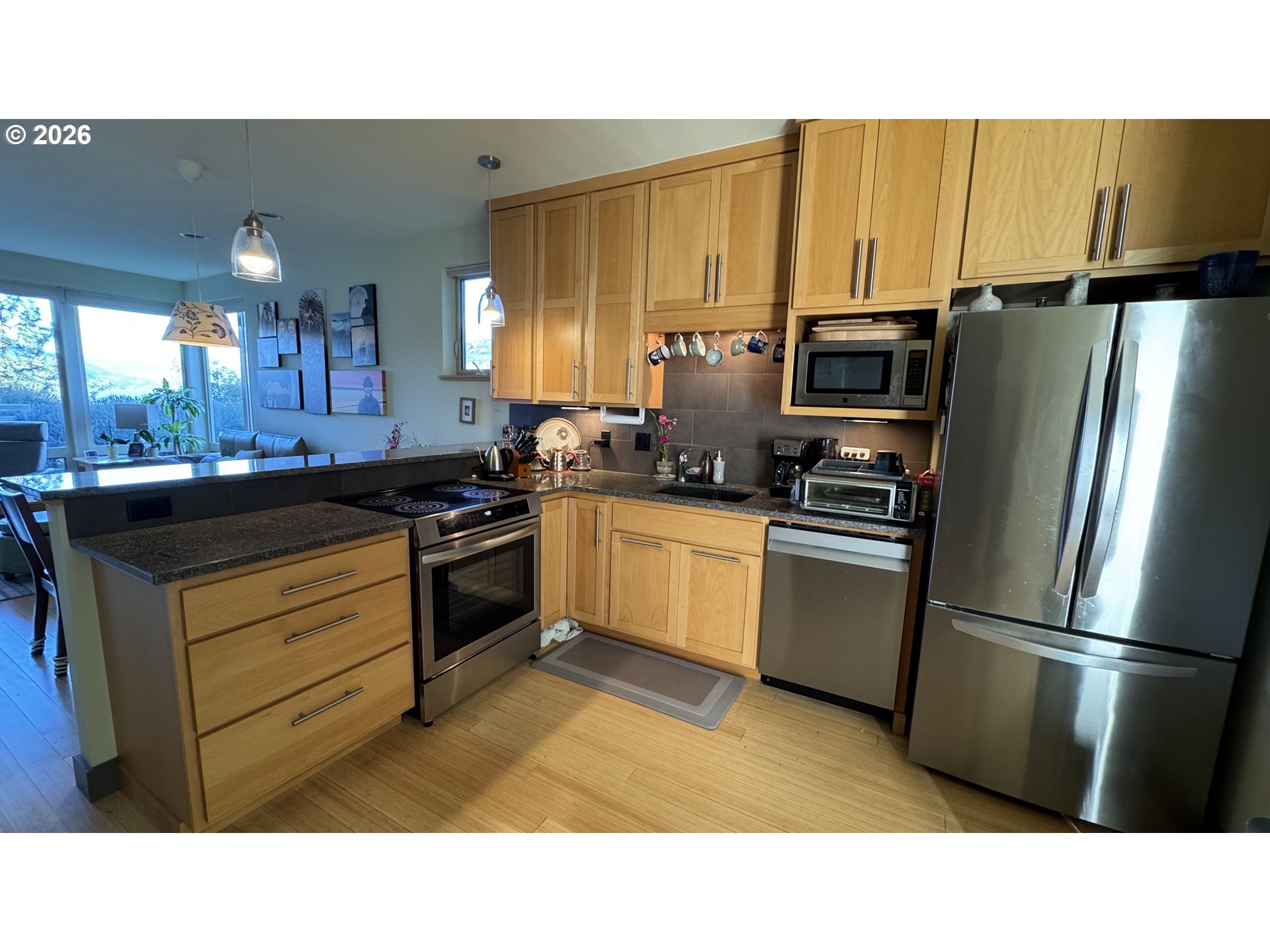 14 Mosier Creek Place Mosier, OR 97040 - Photo 6 of 19 a kitchen with a refrigerator stove and sink