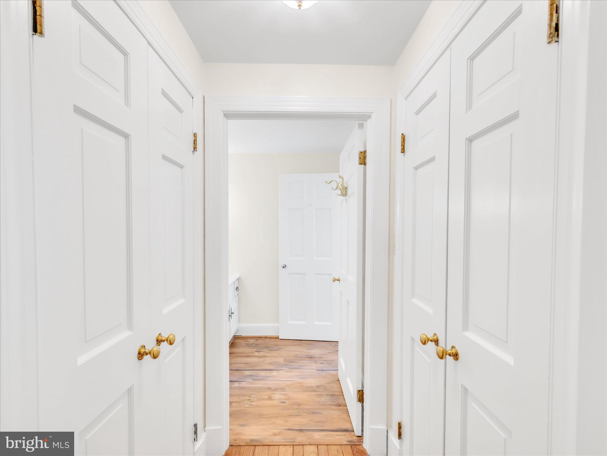 19255 Telegraph Springs Road Purcellville, VA 20132 - Photo 81 of 107 a view of a hallway with wooden floor and closet
