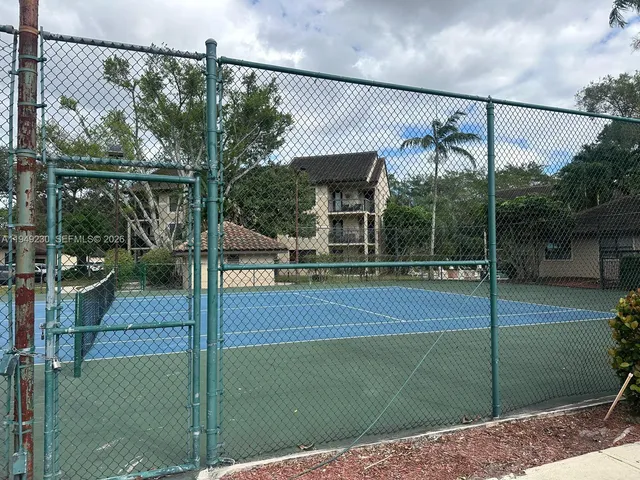 a view of a patio with a table and chairs