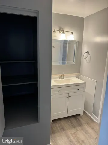 a bathroom with a sink and mirror