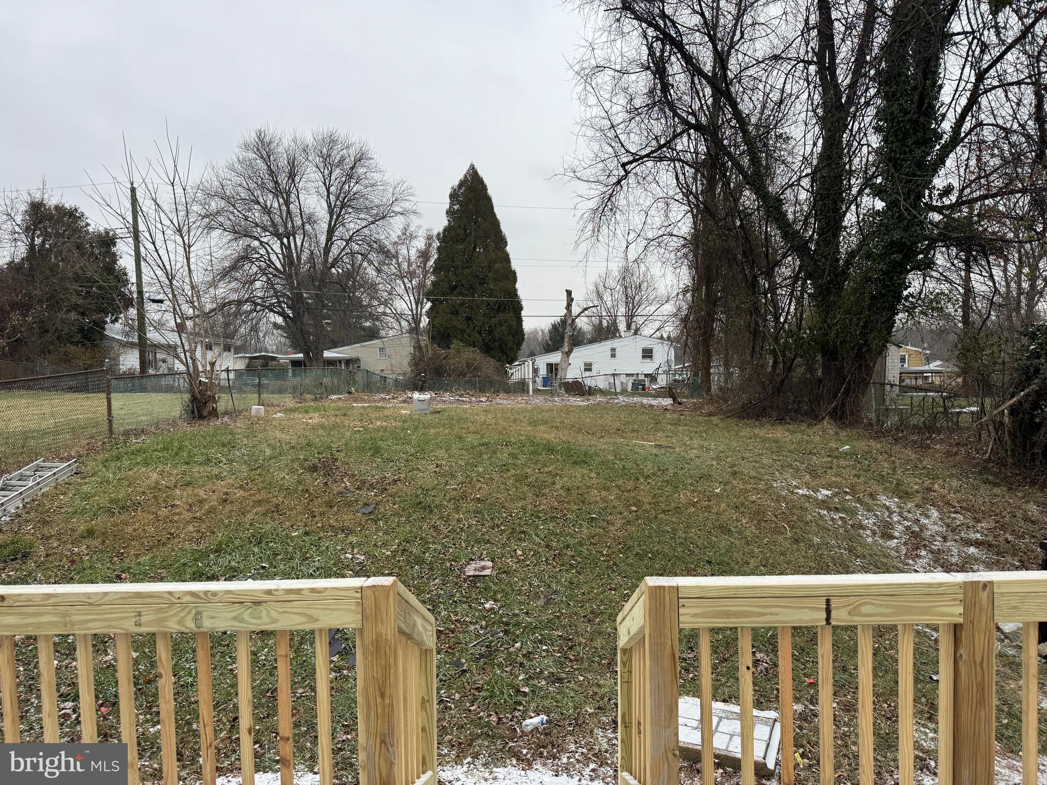 4932 Old Court Road Randallstown, MD 21133 - Photo 7 of 7 a view of a wooden fence and trees