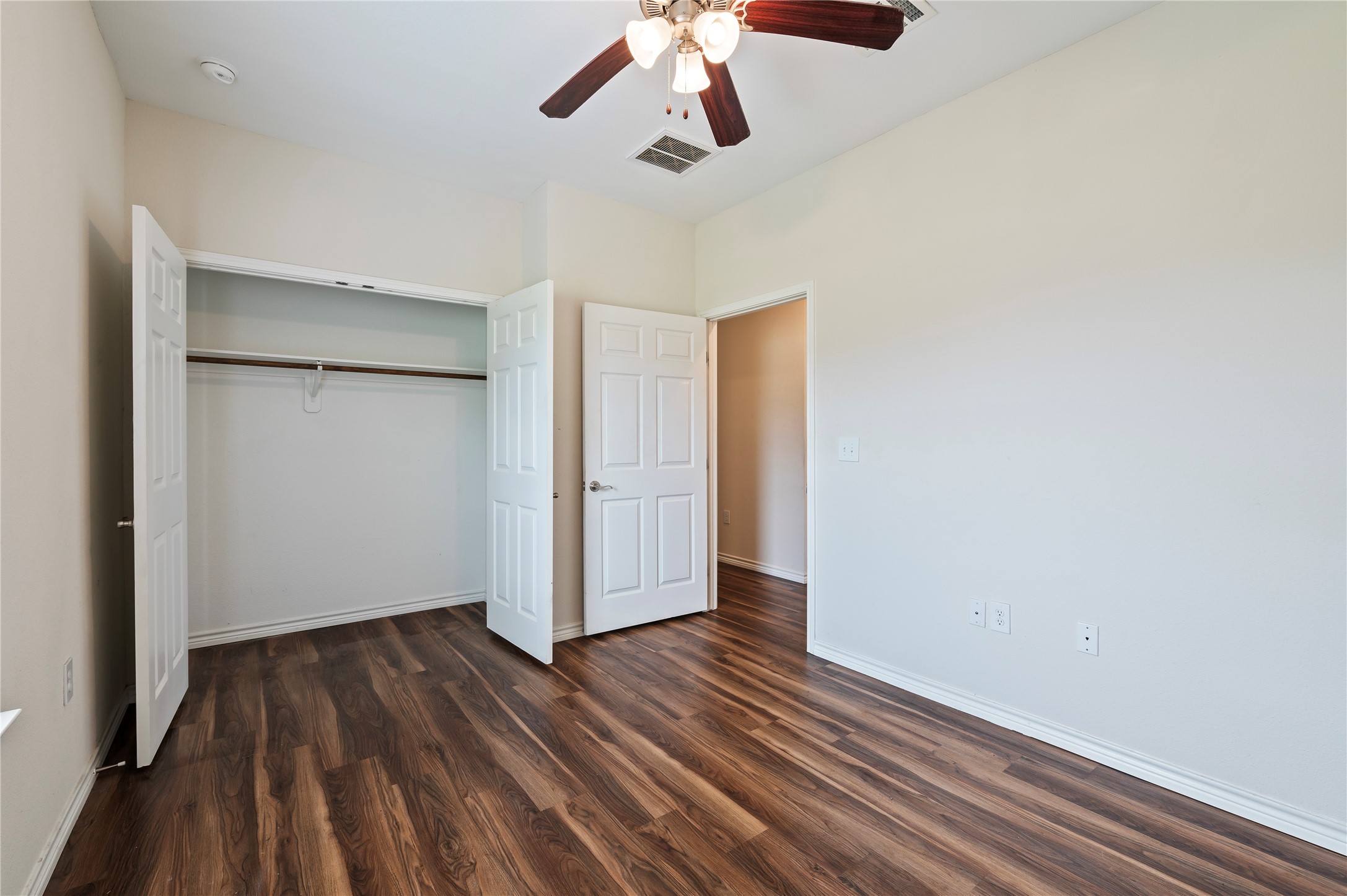 1125 Lake Road La Marque, TX 77568 - Photo 16 of 33 wooden floor in an empty room with a window