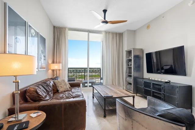 a kitchen with stainless steel appliances granite countertop a stove microwave and refrigerator