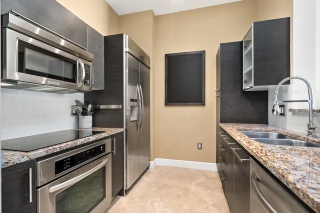 a kitchen with a stove microwave and refrigerator