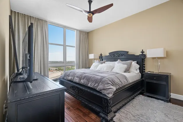 a bedroom with a bed and a television