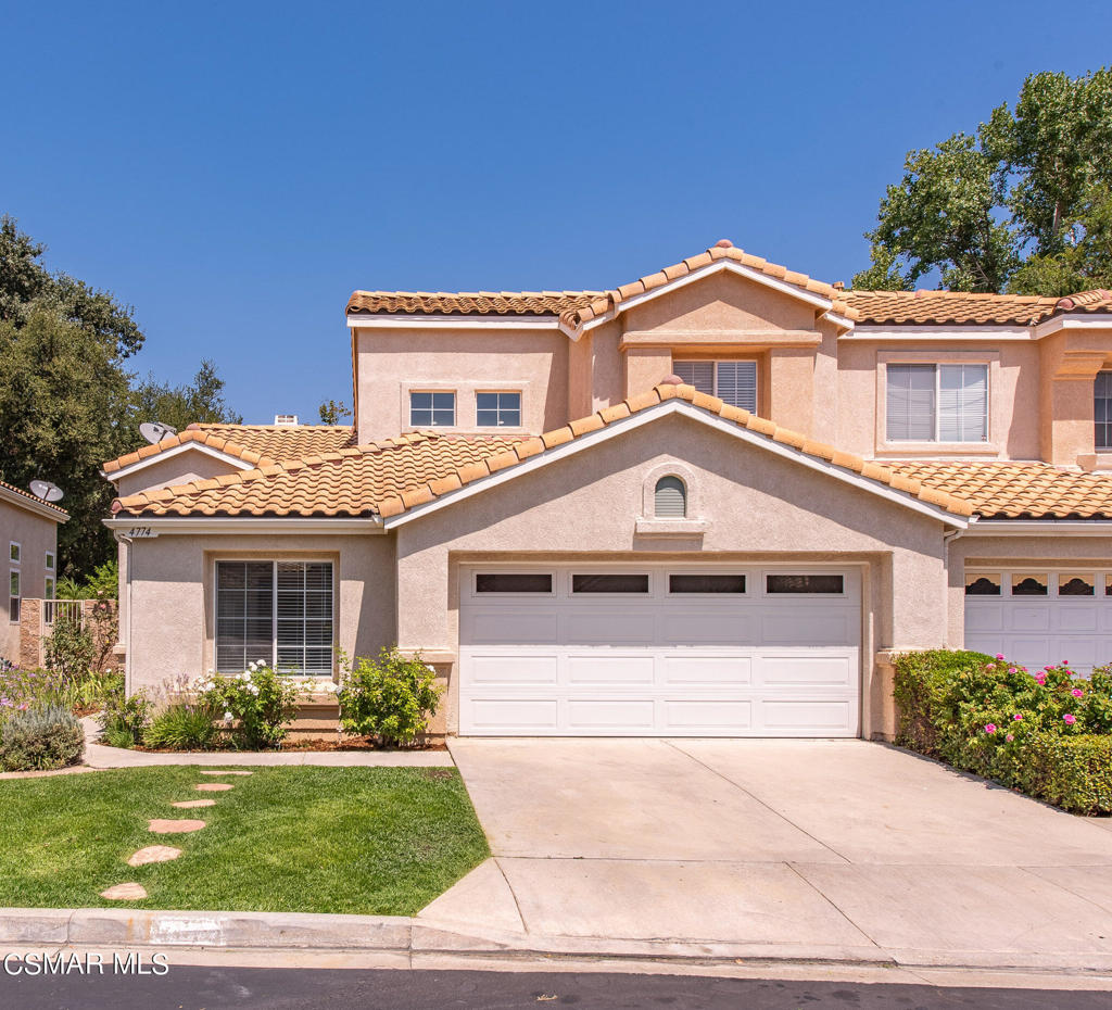 4774 Rhapsody Drive Oak Park, CA 91377 - Photo 1 of 34 a front view of a house with a yard