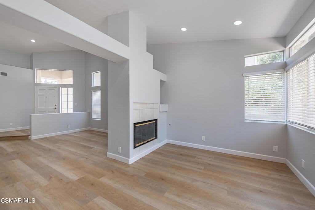 4774 Rhapsody Drive Oak Park, CA 91377 - Photo 11 of 34 a view of an empty room with wooden floor and a window