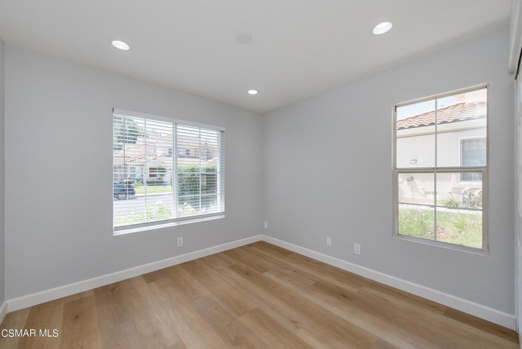 4774 Rhapsody Drive Oak Park, CA 91377 - Photo 26 of 34 an empty room with wooden floor and windows