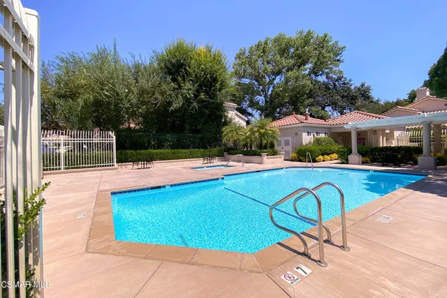 a view of a swimming pool with a patio
