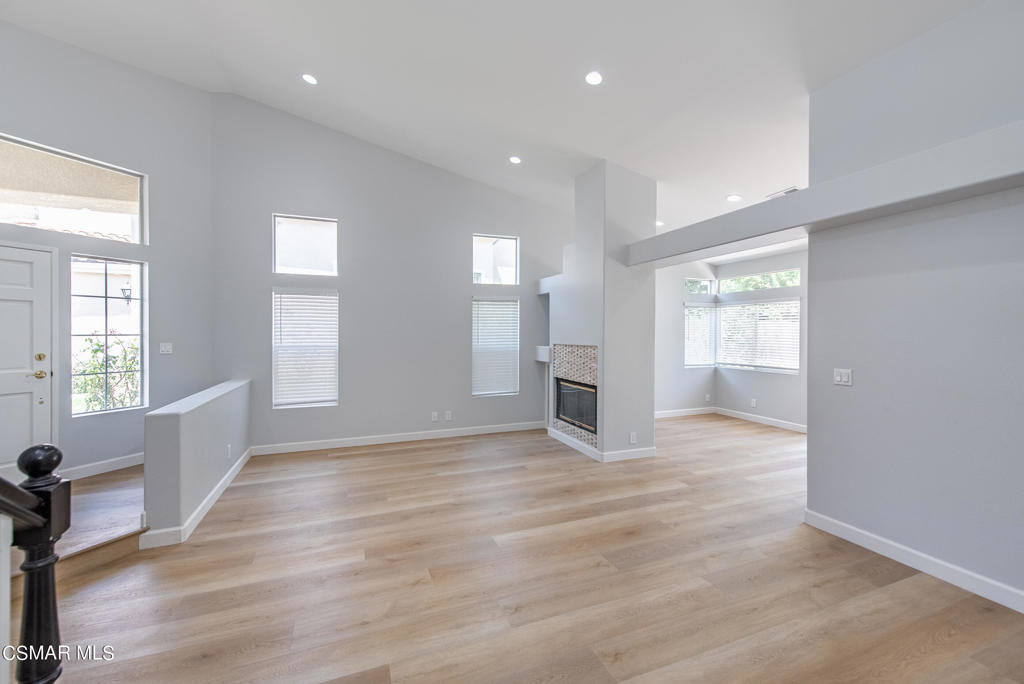4774 Rhapsody Drive Oak Park, CA 91377 - Photo 6 of 34 a view of an empty room with a window and wooden floor
