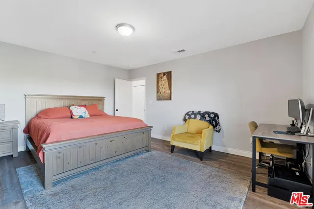 a bathroom with a granite countertop toilet sink and shower