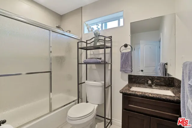 a view of a house with a yard and deck