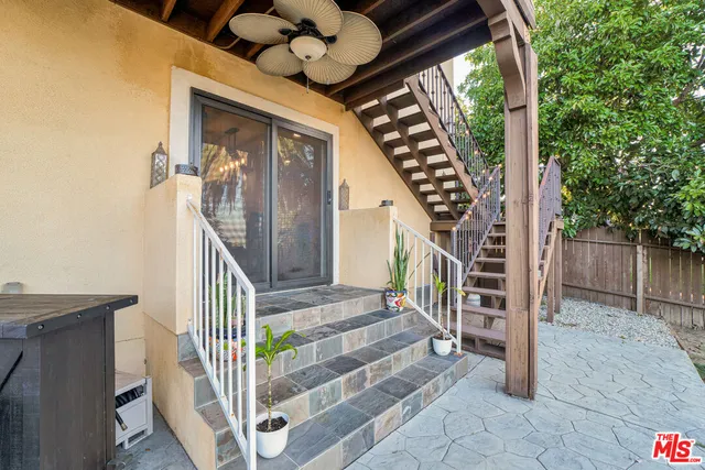a view of a house with yard and furniture