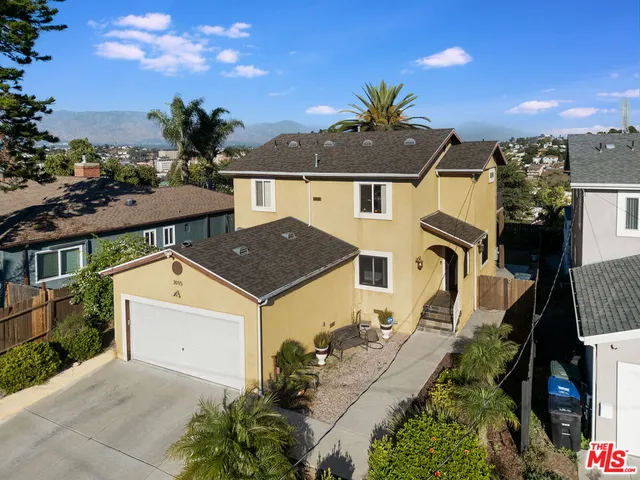 an aerial view of a house with yard swimming pool and outdoor seating