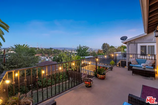 an aerial view of residential houses with outdoor space and street view