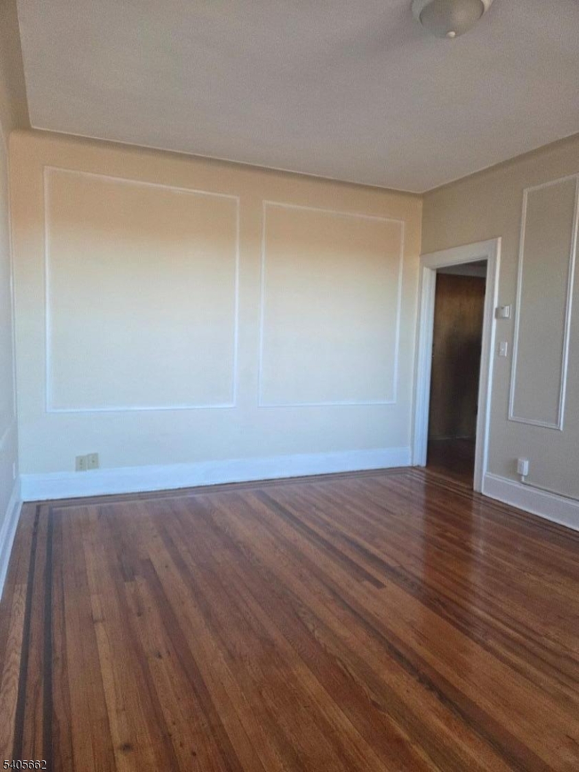 80 Union Avenue, Unit C6 Clifton, NJ 07011 - Photo 3 of 9 a view of an empty room with wooden floor and closet