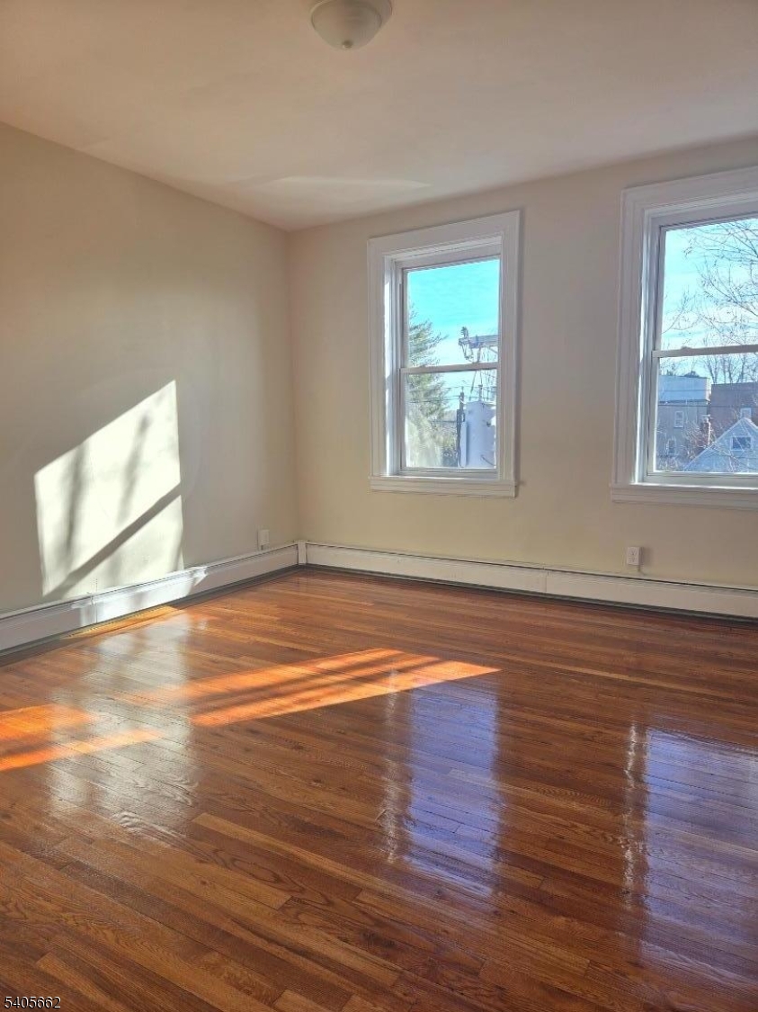 80 Union Avenue, Unit C6 Clifton, NJ 07011 - Photo 5 of 9 a view of empty room with wooden floor and fan