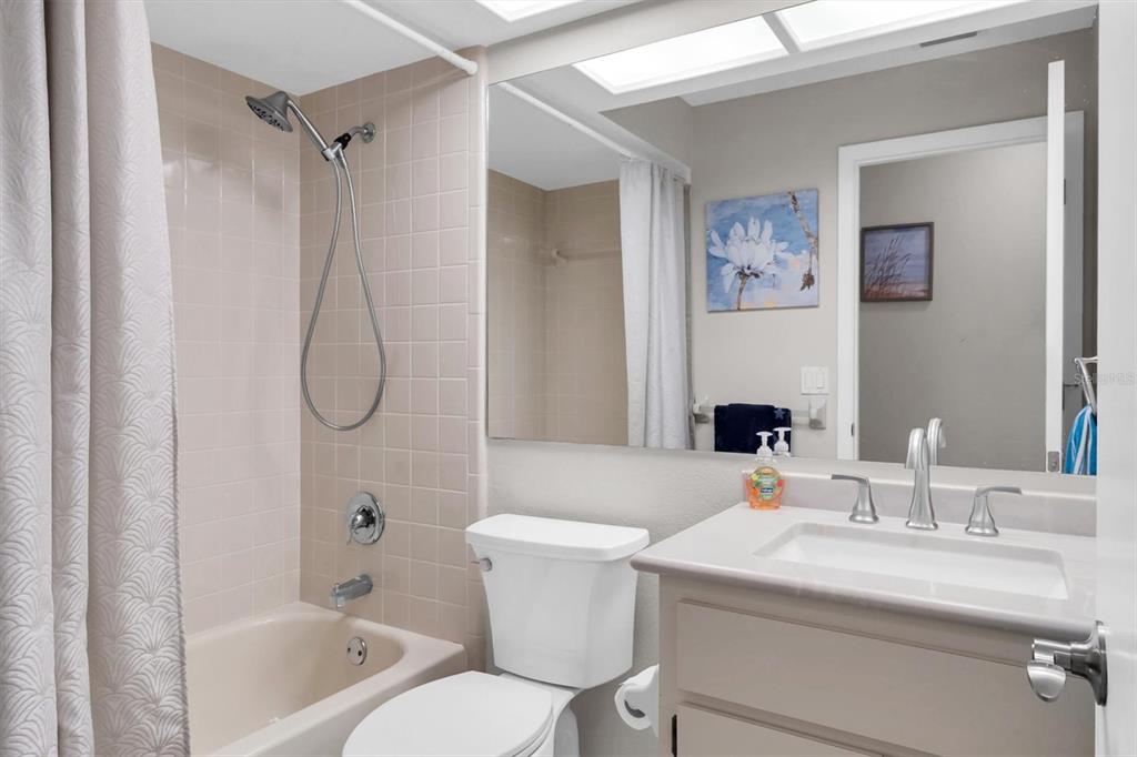 4638 Sheffield Drive New Port Richey, FL 34655 - Photo 16 of 67 a bathroom with a sink a toilet and a bathtub