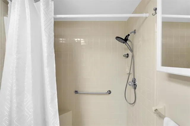 a bedroom with a bed and a workspace