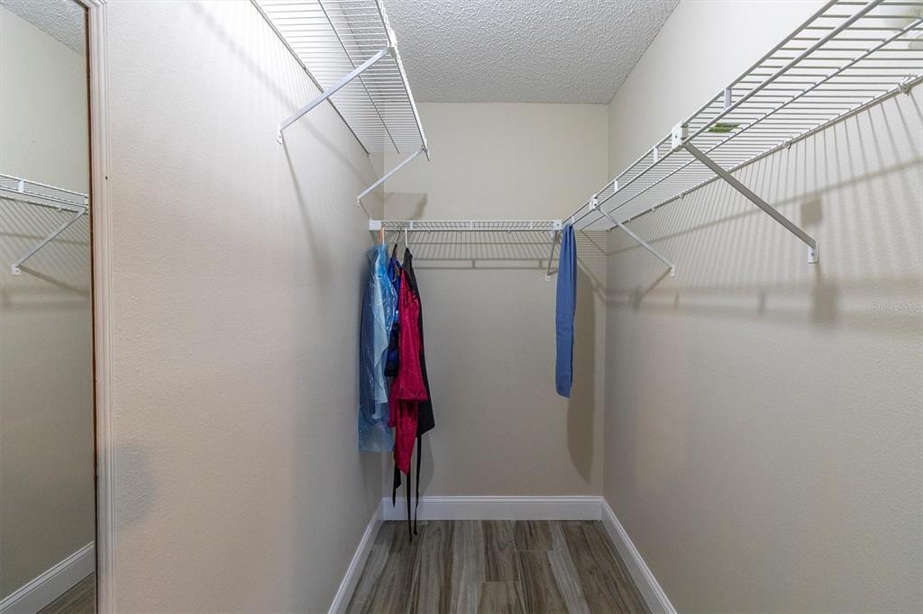 4638 Sheffield Drive New Port Richey, FL 34655 - Photo 22 of 67 a view of walk in closet with clothes