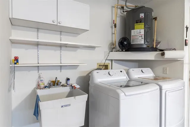 a view of a lake with a yard and trees