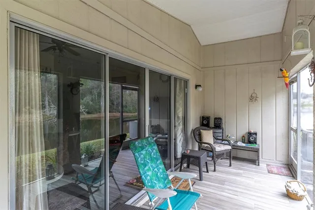 an aerial view of a house with a mountain