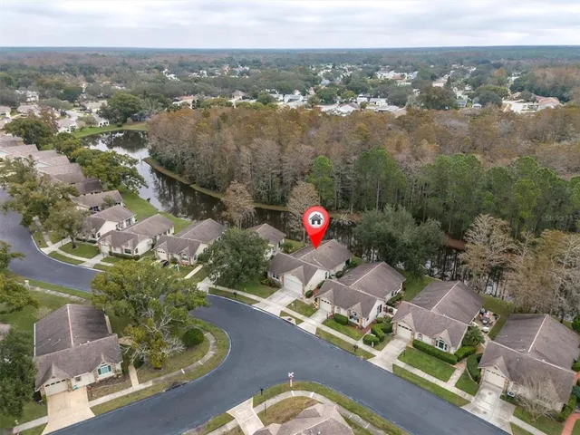 a view of a lake with houses in the back