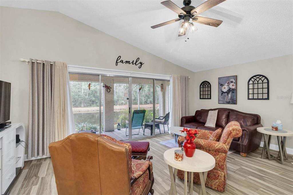 4638 Sheffield Drive New Port Richey, FL 34655 - Photo 7 of 67 a living room with furniture and a flat screen tv