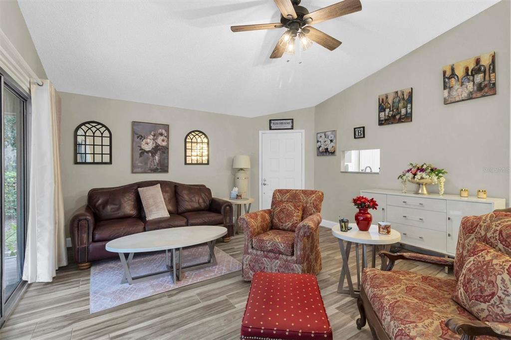 4638 Sheffield Drive New Port Richey, FL 34655 - Photo 9 of 67 a living room with furniture and wooden floor