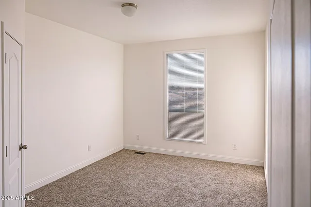 a view of walk in closet with living room
