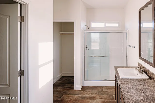 a bathroom with a toilet and a mirror