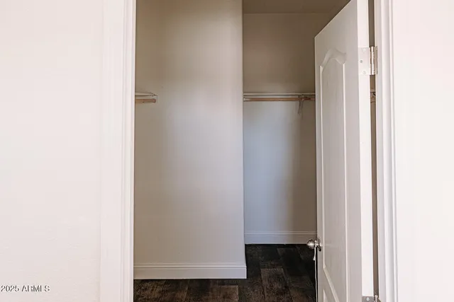 a view of a hallway with a white walls