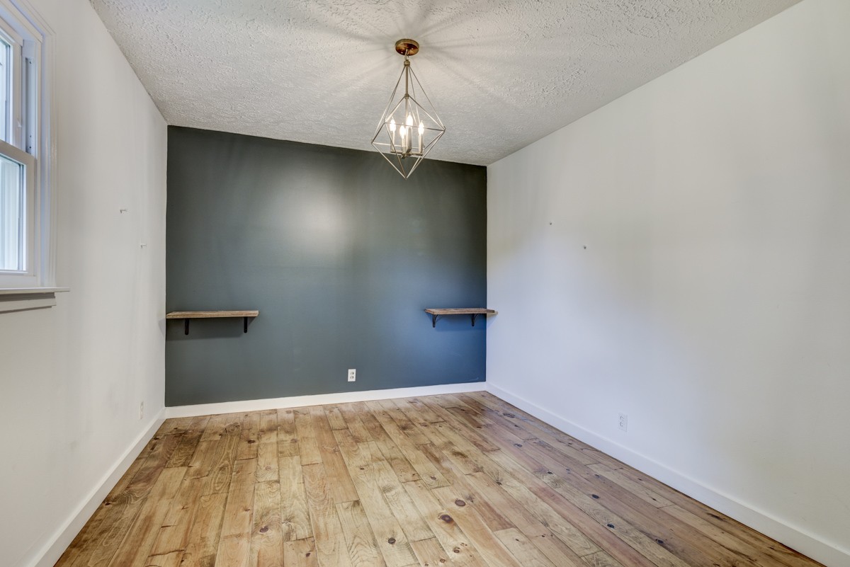 341 Lee Road Cottontown, TN 37048 - Photo 21 of 43 a view of a room with wooden floor and ceiling fan