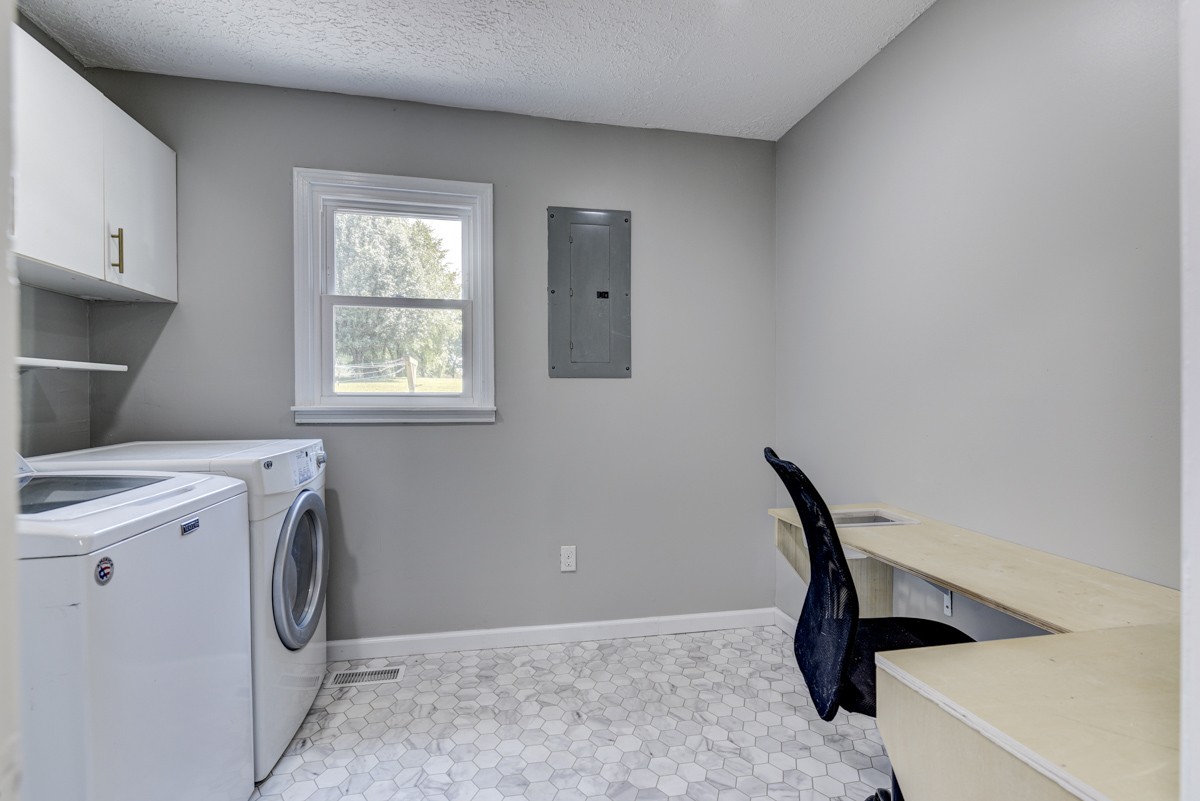 341 Lee Road Cottontown, TN 37048 - Photo 27 of 43 a view of storage and utility room with washer and dryer