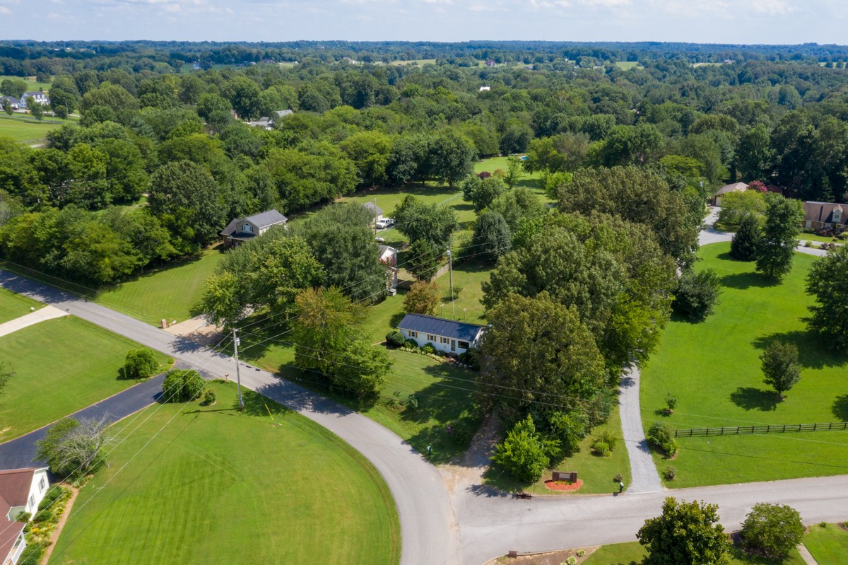 341 Lee Road Cottontown, TN 37048 - Photo 3 of 43 an aerial view of a golf course with a yard