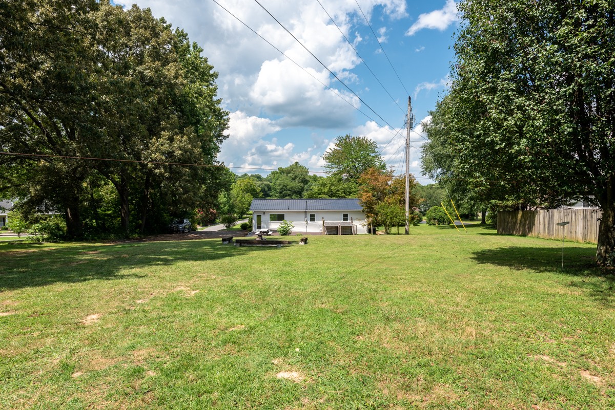 341 Lee Road Cottontown, TN 37048 - Photo 36 of 43 a view of a house with backyard and sitting area